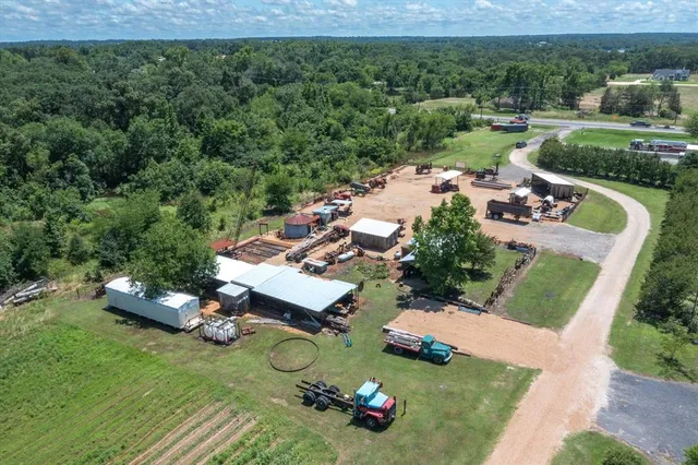 an aerial view of a house with garden space and street view