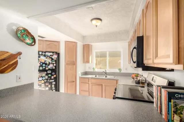 a large white kitchen with a lot of cabinets and a stove