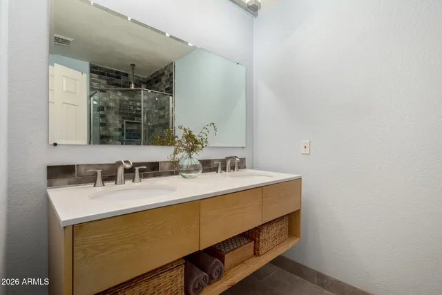 a bathroom with a sink and a mirror