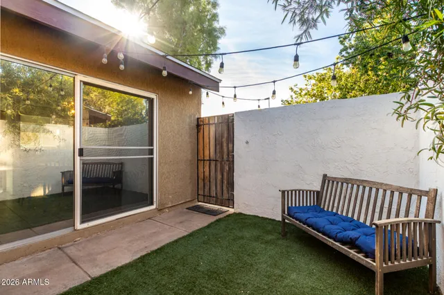 a view of a backyard with swimming pool
