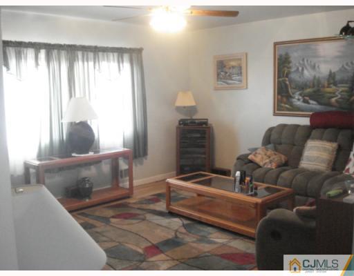 17 Lehigh Road Old Bridge, NJ 08859 - Photo 2 of 10 a living room with furniture and a window