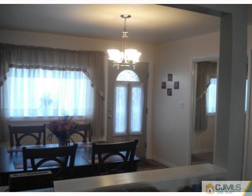 17 Lehigh Road Old Bridge, NJ 08859 - Photo 5 of 10 a view of a room with wooden floor and windows