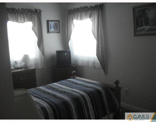 17 Lehigh Road Old Bridge, NJ 08859 - Photo 10 of 10 a bedroom with a bed and a window