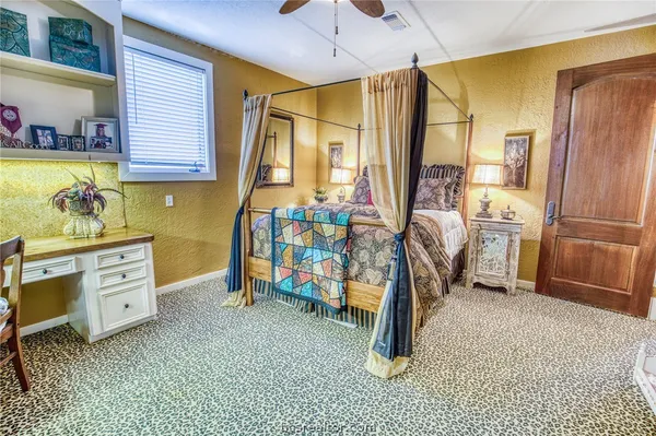 a view of a bedroom with gym equipment