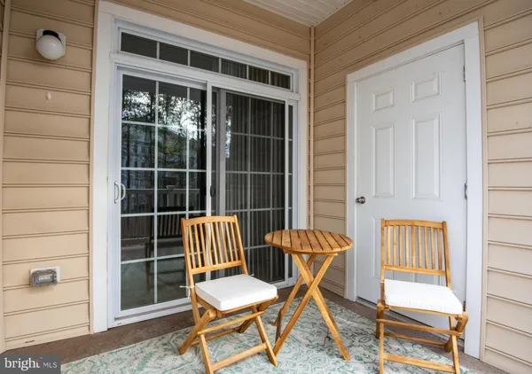 a outdoor view with a chair and dining table