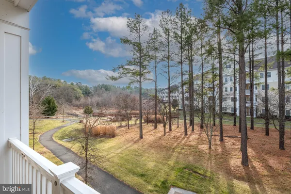 a view of a balcony with furniture