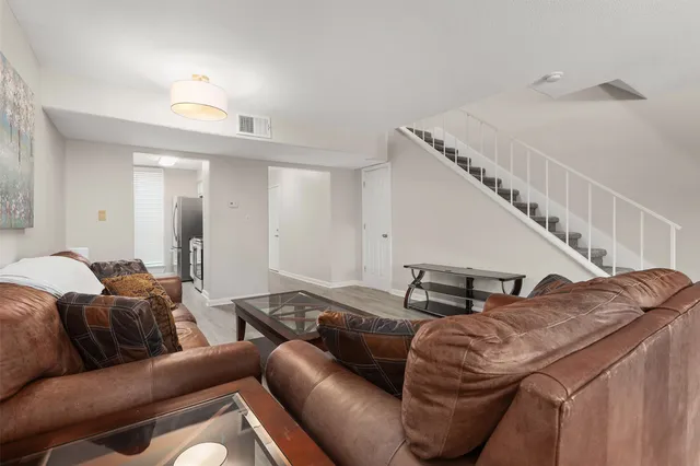 a living room with furniture or stairs and a couch