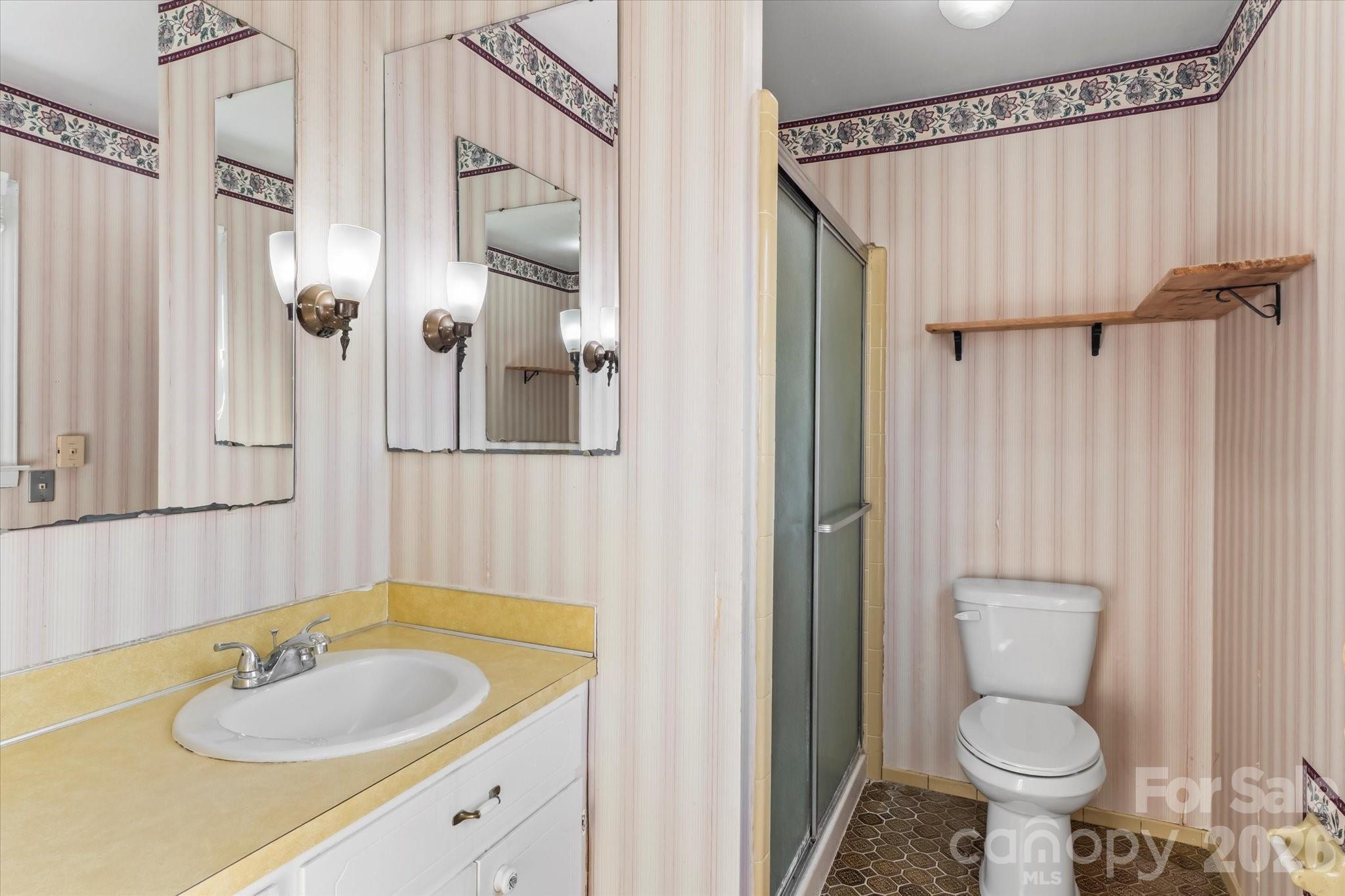 3000 Windrow Lane Matthews, NC 28105 - Photo 17 of 20 a bathroom with a granite countertop sink toilet and a mirror