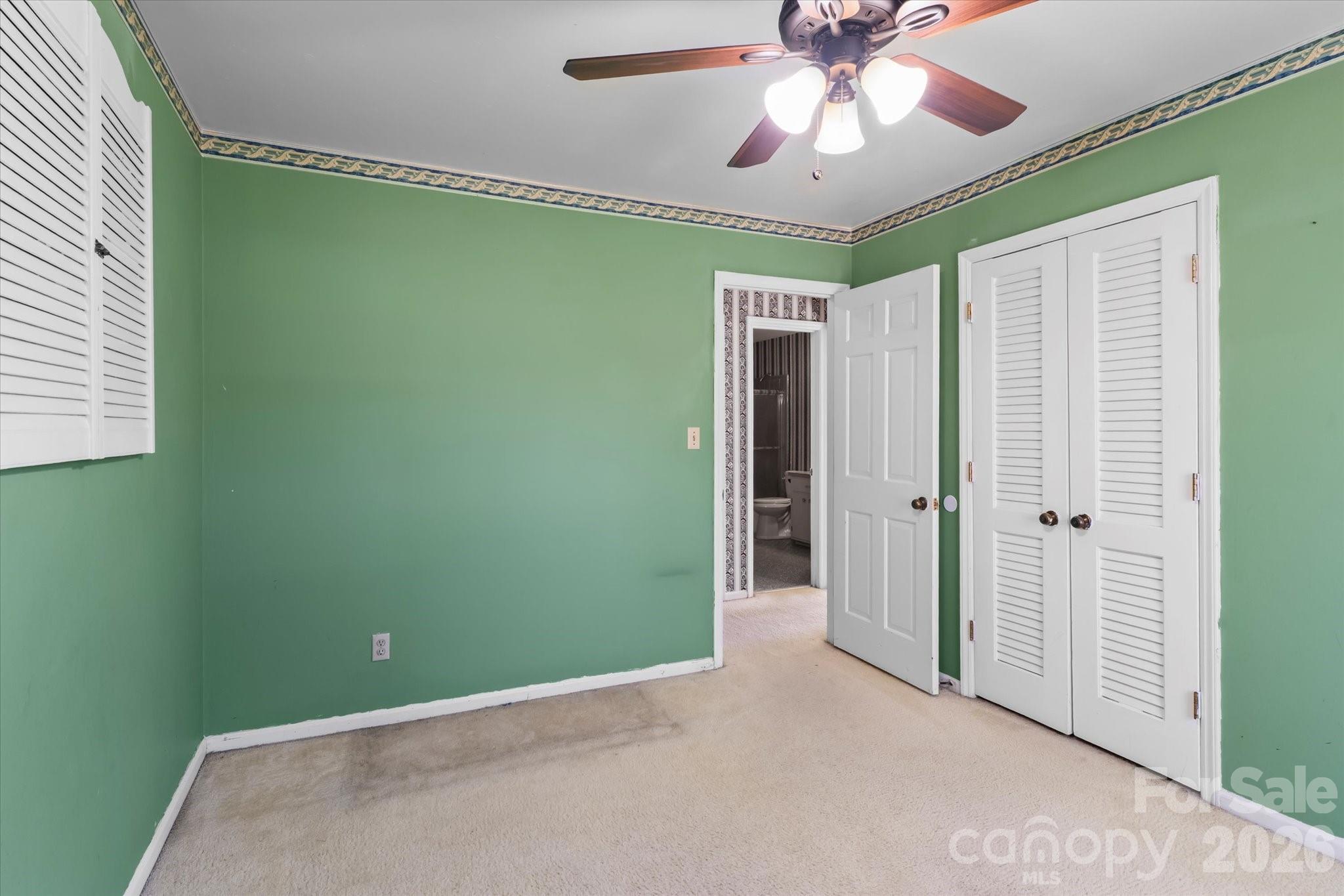 3000 Windrow Lane Matthews, NC 28105 - Photo 19 of 20 a view of empty room with window and a ceiling fan