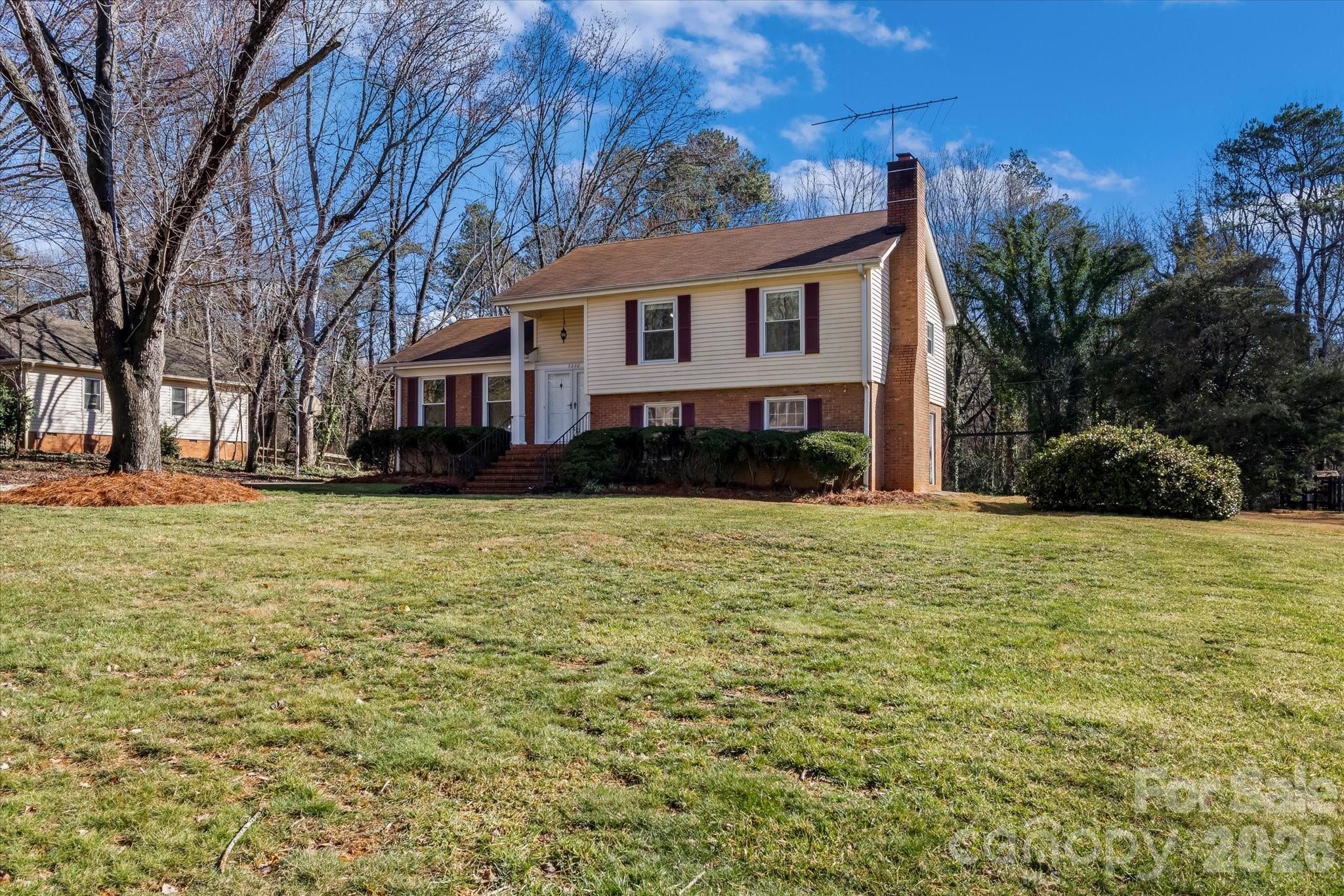 3000 Windrow Lane Matthews, NC 28105 - Photo 2 of 20 a front view of a house with a yard