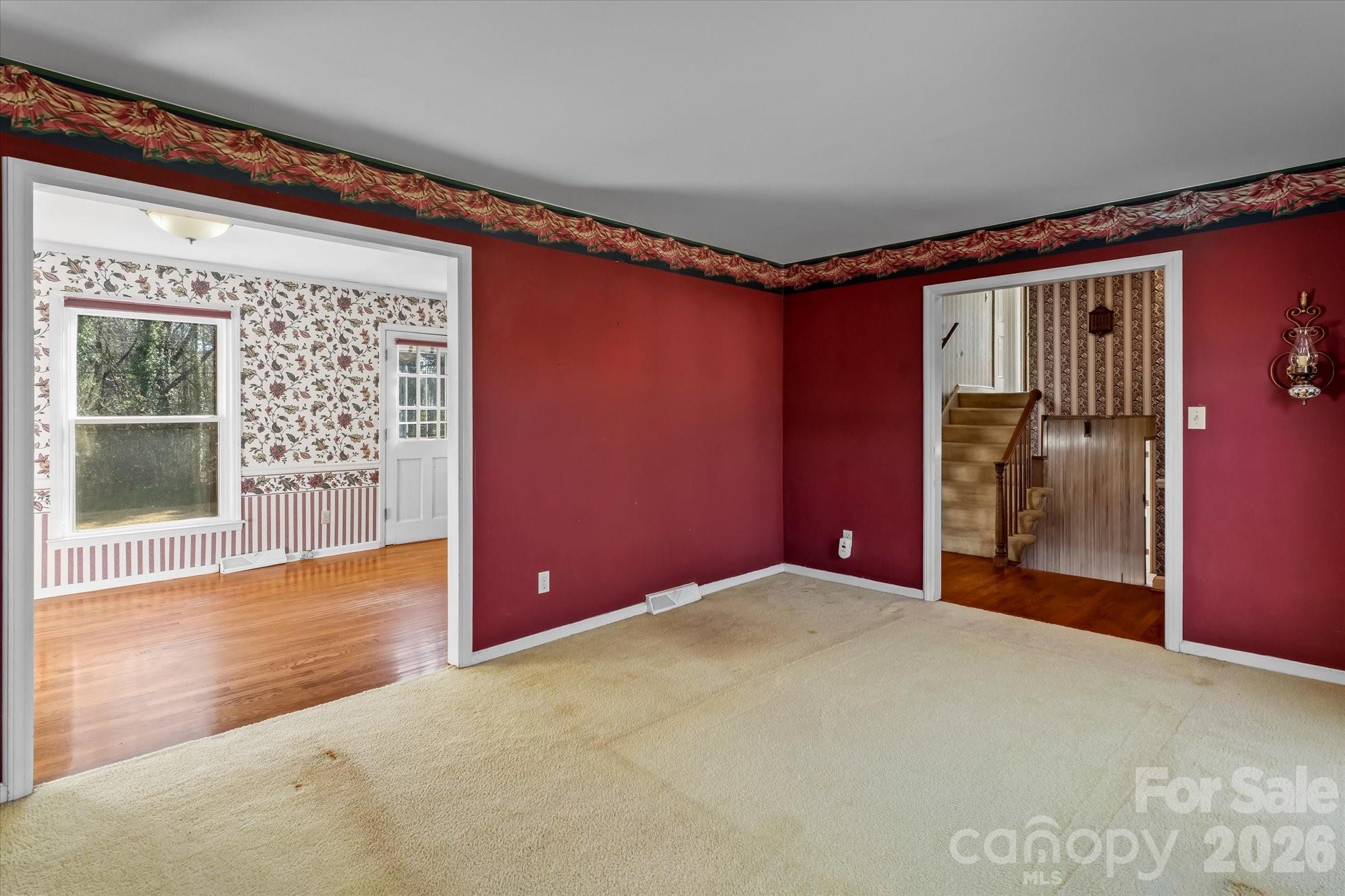 3000 Windrow Lane Matthews, NC 28105 - Photo 7 of 20 a view of a livingroom with an empty space and a window