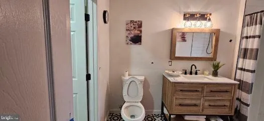 a bathroom with a sink vanity and mirror