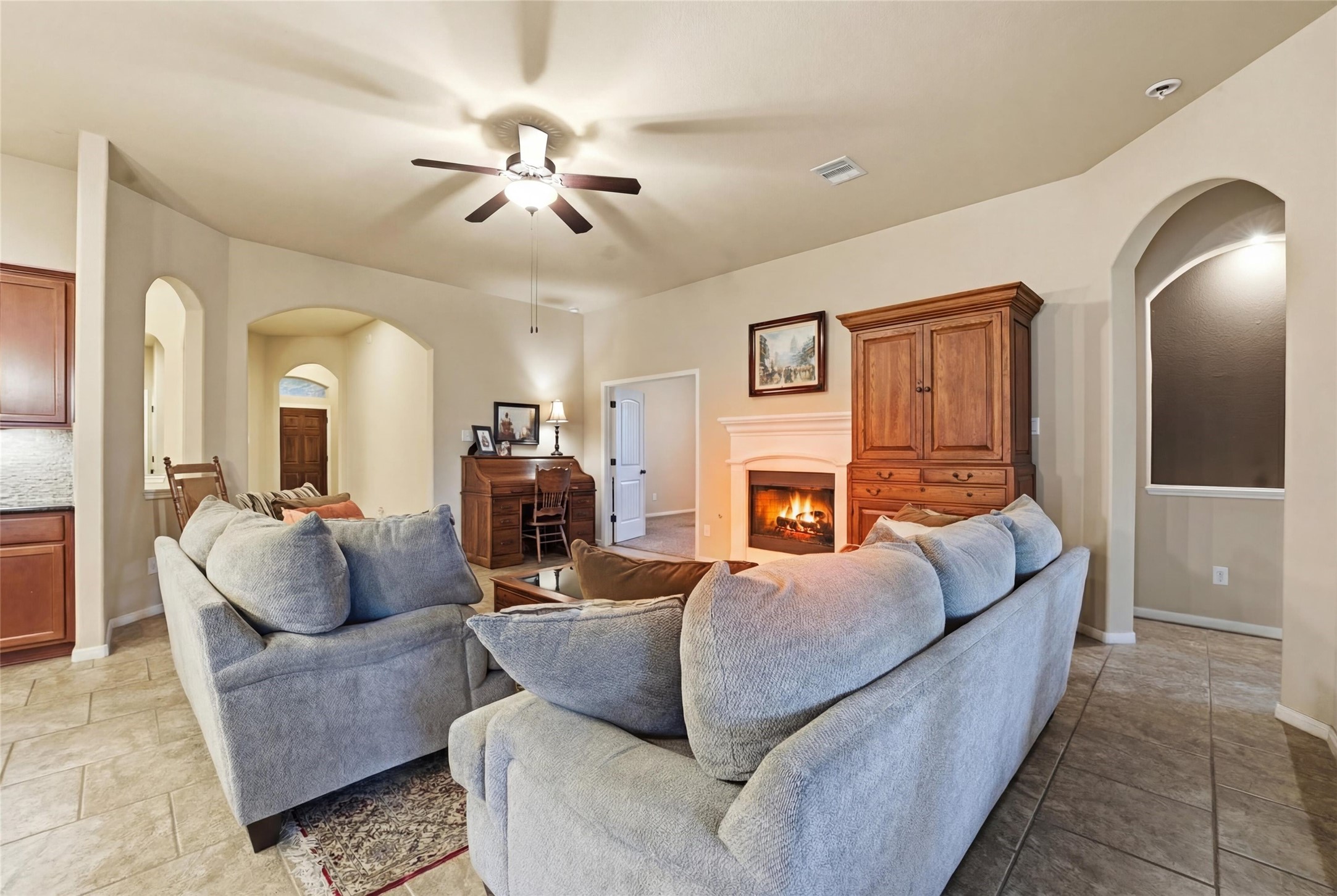 18115 Oliveria Way Houston, TX 77044 - Photo 11 of 32 a living room with furniture and a fireplace