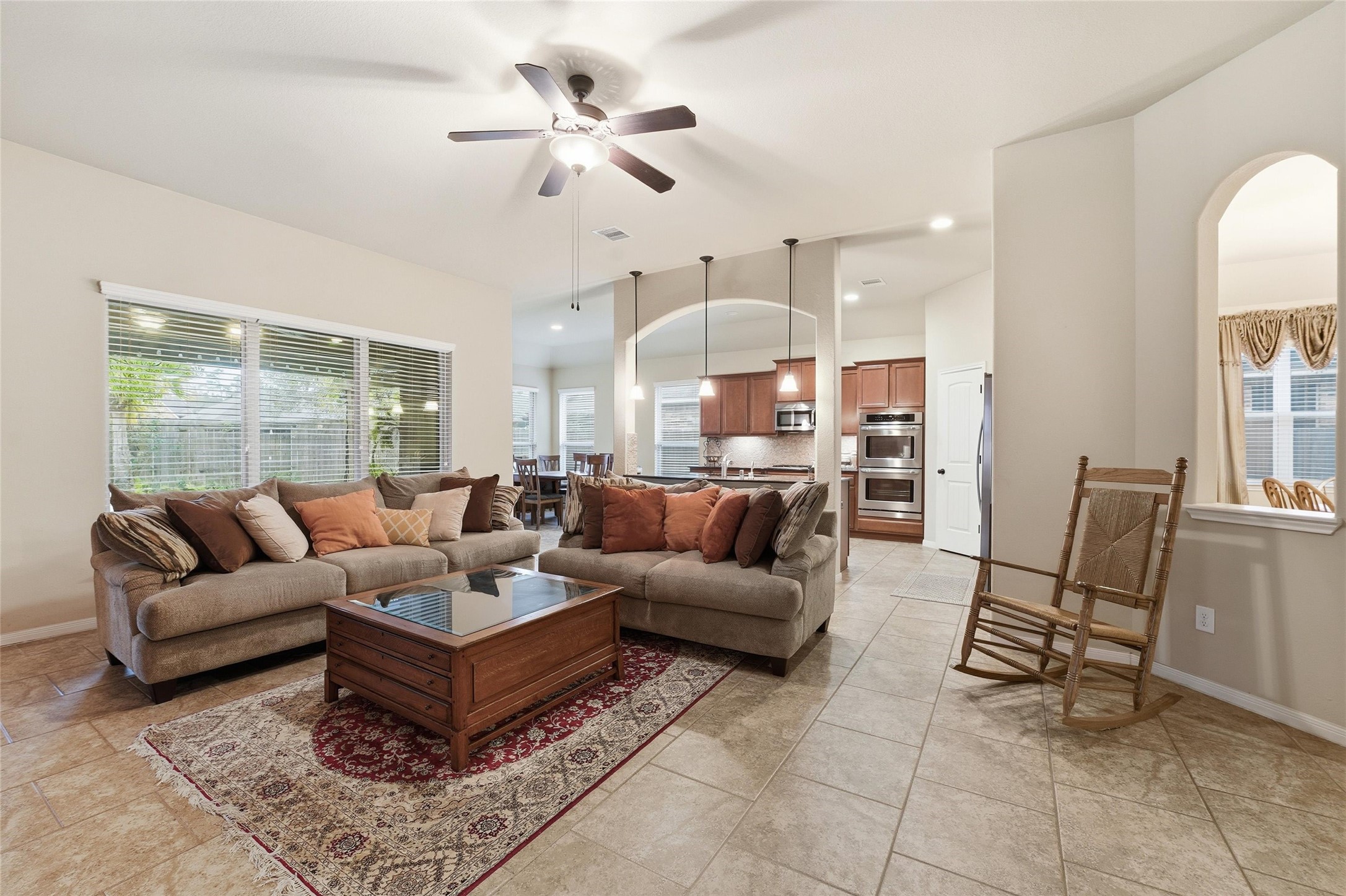 18115 Oliveria Way Houston, TX 77044 - Photo 12 of 32 a living room with furniture kitchen view and a large window