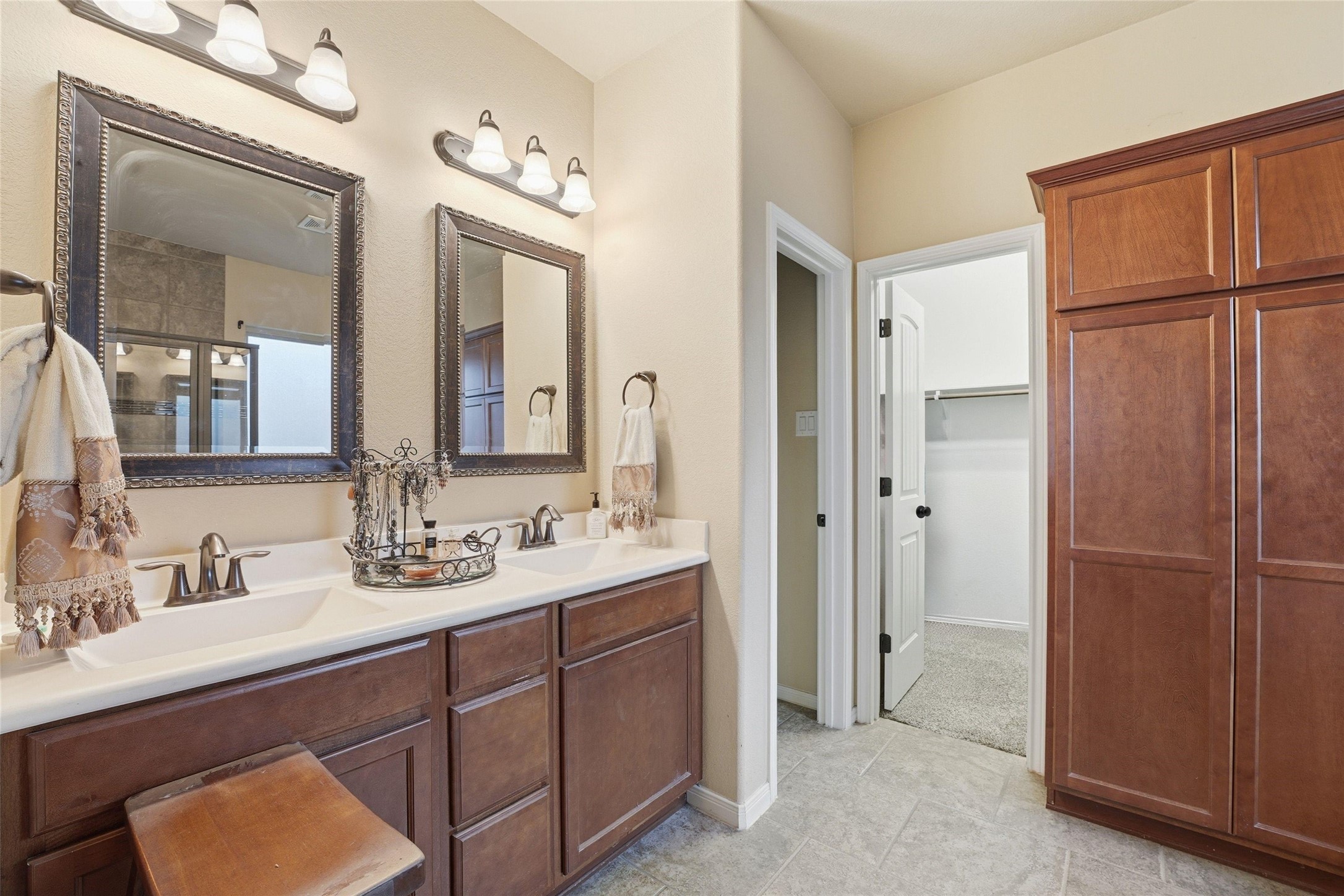 18115 Oliveria Way Houston, TX 77044 - Photo 16 of 32 a bathroom with a double vanity sink and mirror