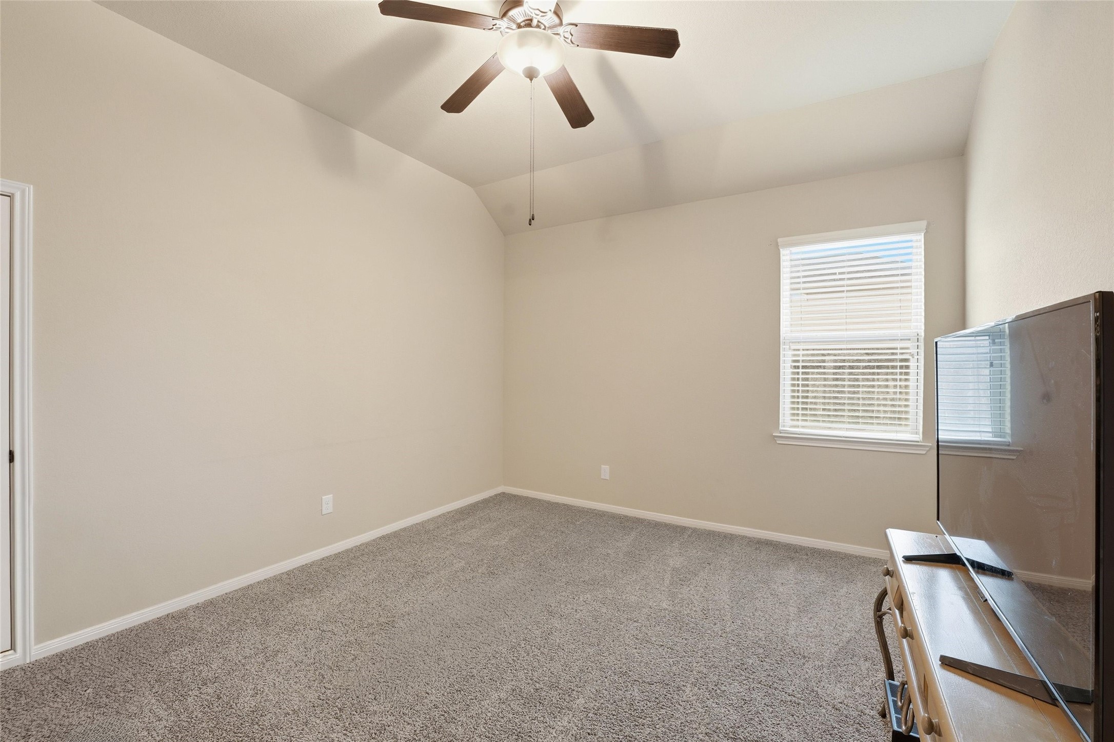 18115 Oliveria Way Houston, TX 77044 - Photo 18 of 32 a view of an empty room with a window