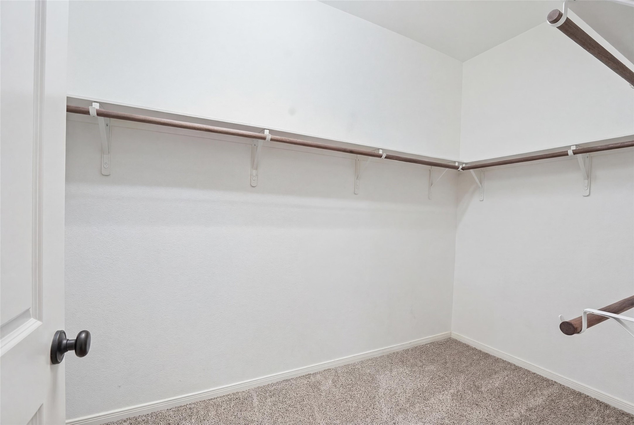 18115 Oliveria Way Houston, TX 77044 - Photo 19 of 32 a view of an empty walk in closet