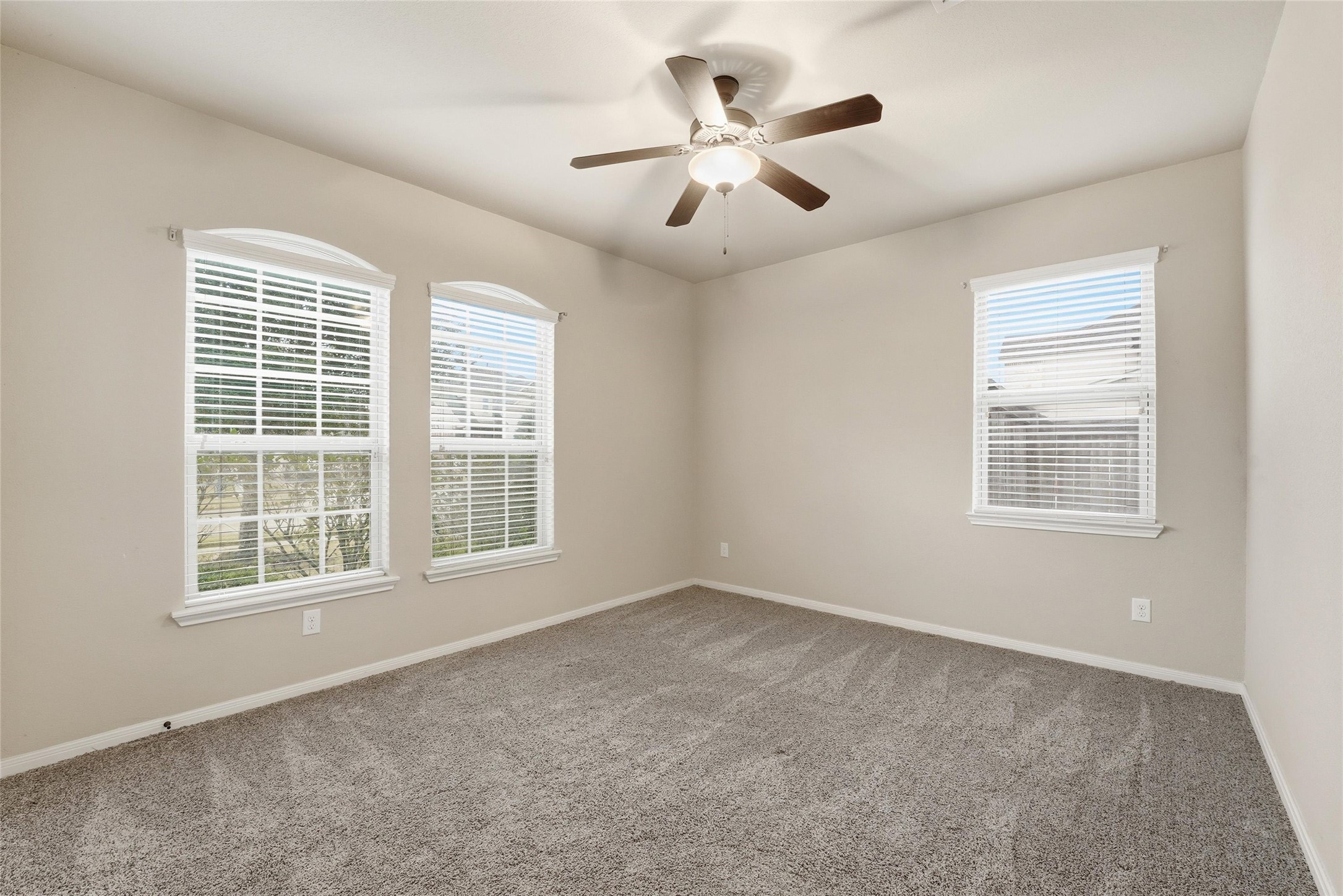 18115 Oliveria Way Houston, TX 77044 - Photo 20 of 32 an empty room with windows and fan