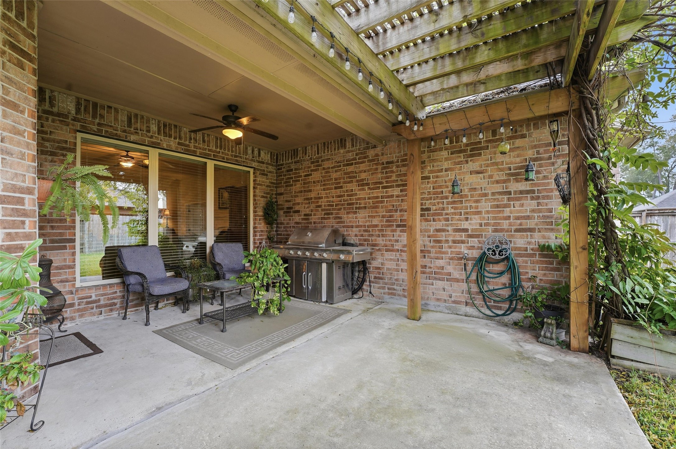 18115 Oliveria Way Houston, TX 77044 - Photo 24 of 32 a view of a patio with table and chairs and potted plants