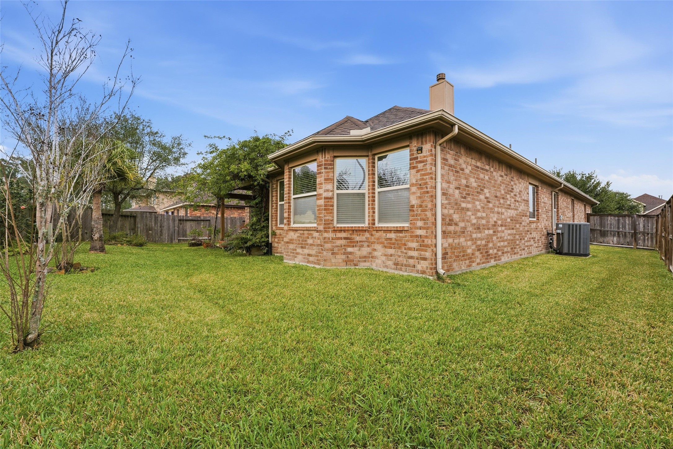 18115 Oliveria Way Houston, TX 77044 - Photo 26 of 32 a front view of a house with a garden