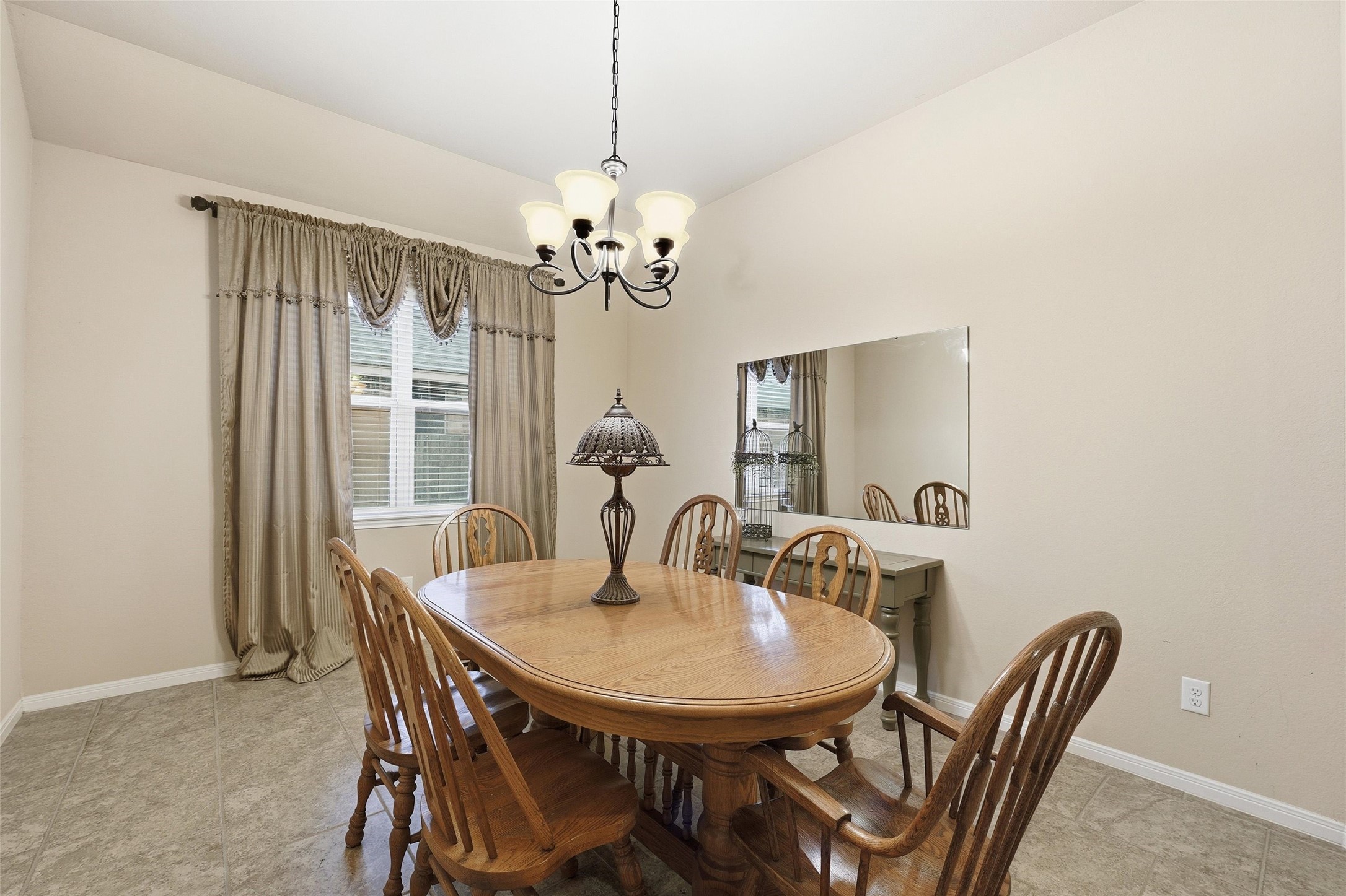 18115 Oliveria Way Houston, TX 77044 - Photo 5 of 32 a view of a dining room with furniture window and outside view