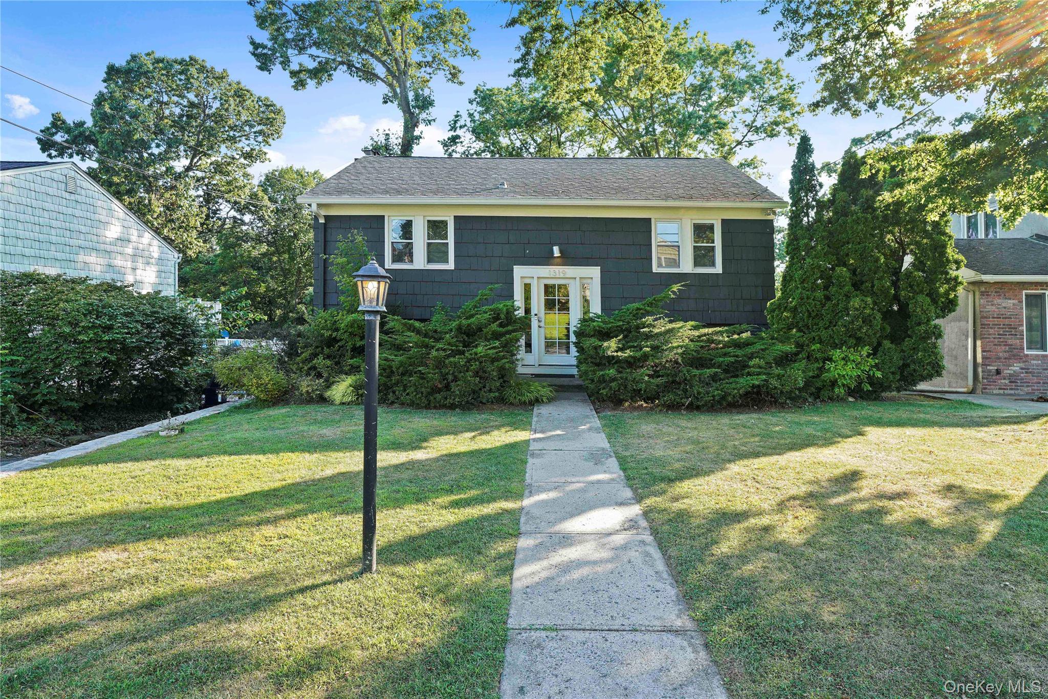 a view of backyard with a garden and plants