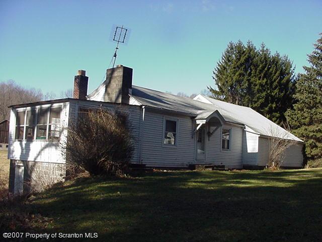 54 Lake Wilderness Road Tunkhannock, PA 18657 - Photo 2 of 2 a view of a house with backyard and garden