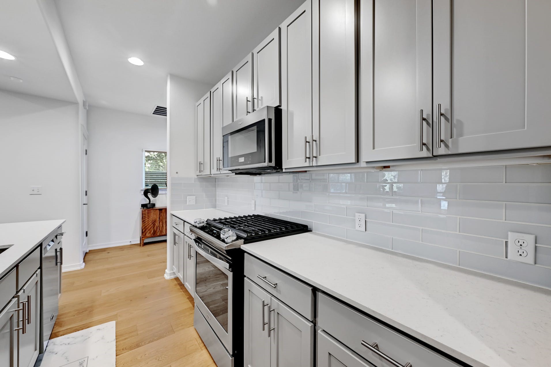 6800 Menchaca Road, Unit 24 Austin, TX 78745 - Photo 8 of 22 a kitchen with stainless steel appliances granite countertop a sink stove and cabinets
