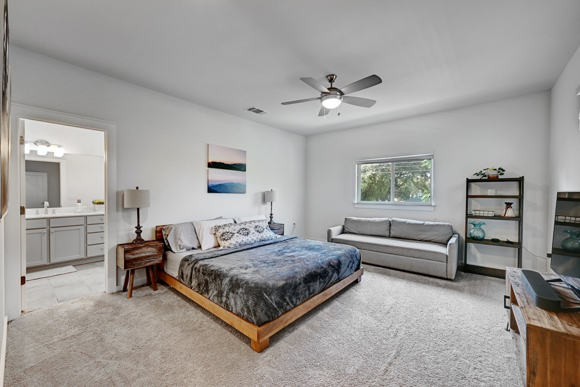 6800 Menchaca Road, Unit 24 Austin, TX 78745 - Photo 9 of 22 a bedroom with a bed couch and a window