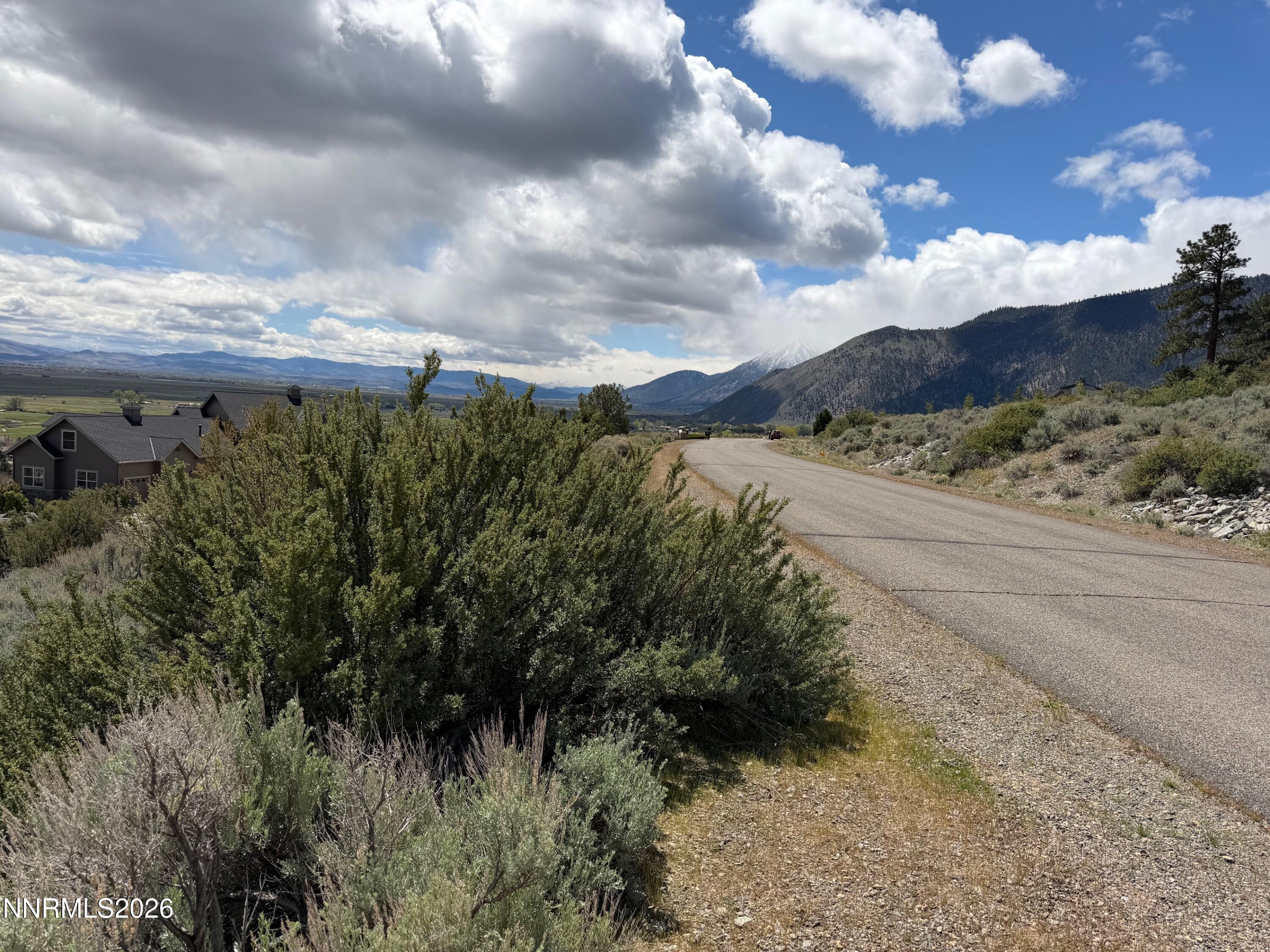 2527 Eagle Ridge Road, Unit LOT 41 Genoa, NV 89411 - Photo 7 of 8 a view of a lake with mountains in the background