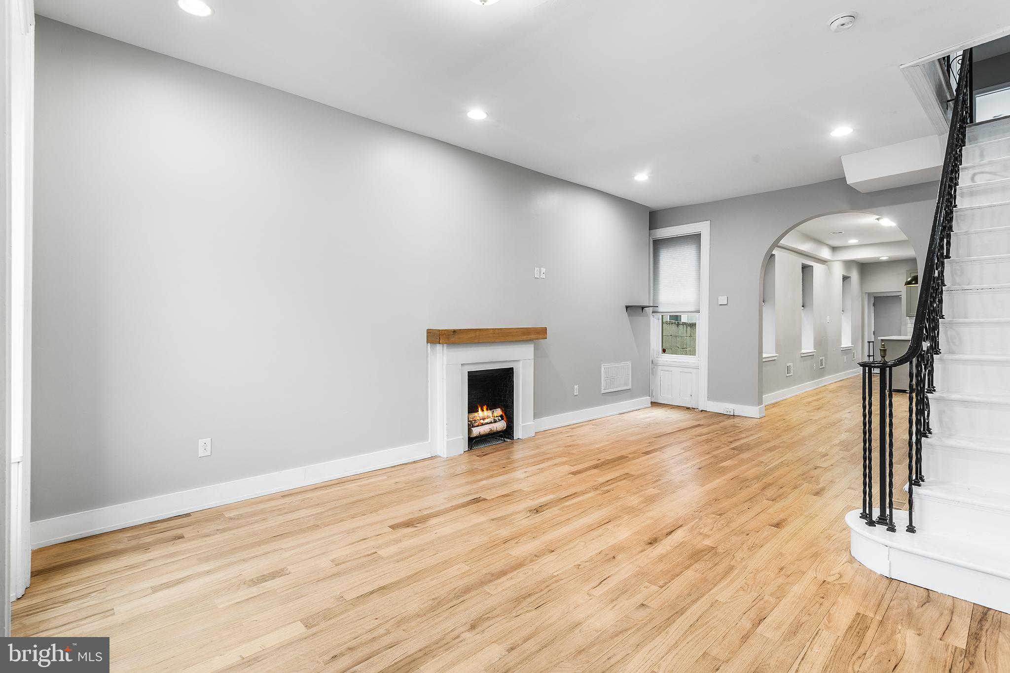 2340 West Thompson Street Philadelphia, PA 19121 - Photo 3 of 36 Large living room with decorative fireplace
