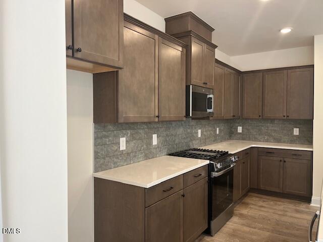 703 Chopper Lane, Unit 12 Durham, NC 27703 - Photo 2 of 4 a kitchen with a sink and cabinets