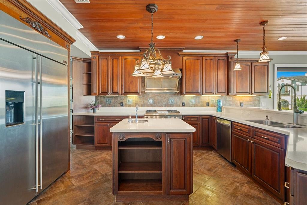 2 Mar Azul North Ponce Inlet, FL 32127 - Photo 30 of 98 a kitchen with kitchen island granite countertop a sink stainless steel appliances and cabinets