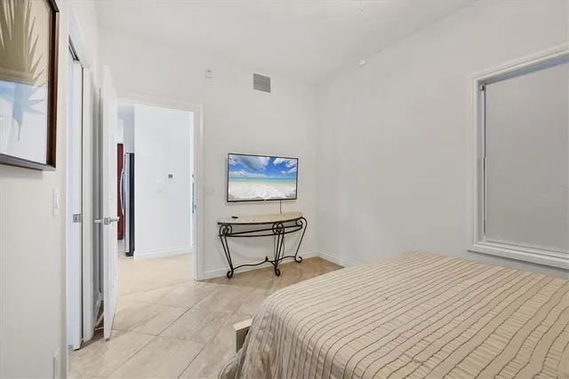 a bedroom with a bed and a table