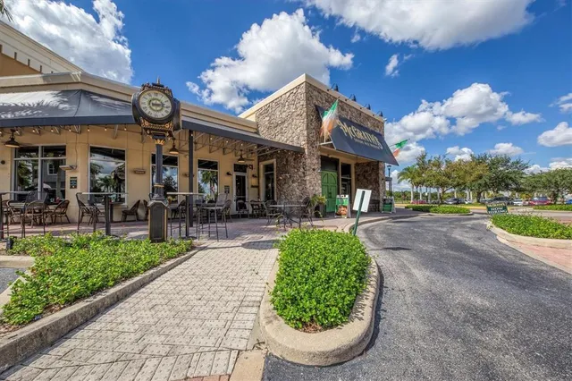 a view of a house with fountain garden and plants