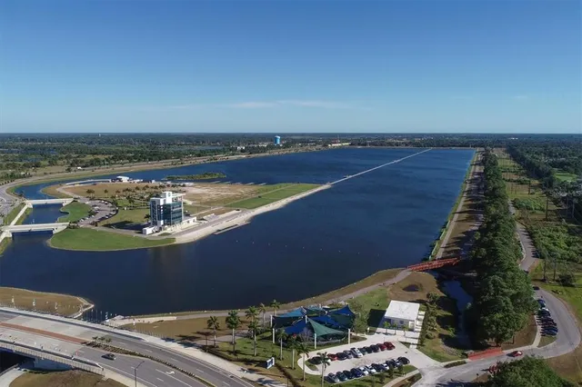 a view of a balcony with wooden floor and a yard