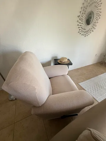 a view of a green yard with a small pool