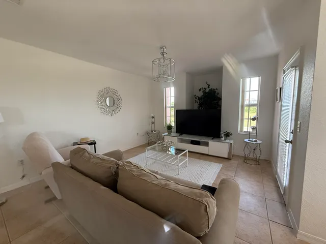 a utility room with sink dryer and washer