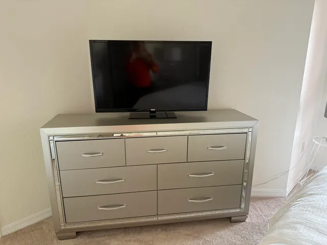 a kitchen with stainless steel appliances granite countertop a sink a stove and a microwave