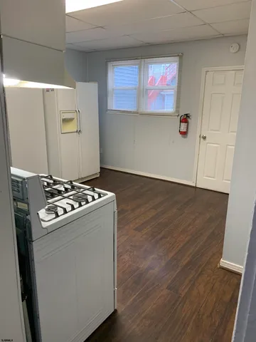 a view of kitchen island with wooden floor