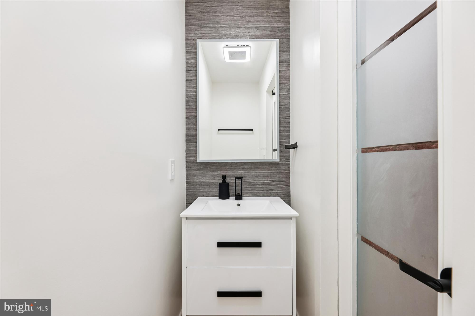 746 Morton Street Northwest, Unit 1 Washington, DC 20010 - Photo 13 of 35 a bathroom with a sink and a mirror