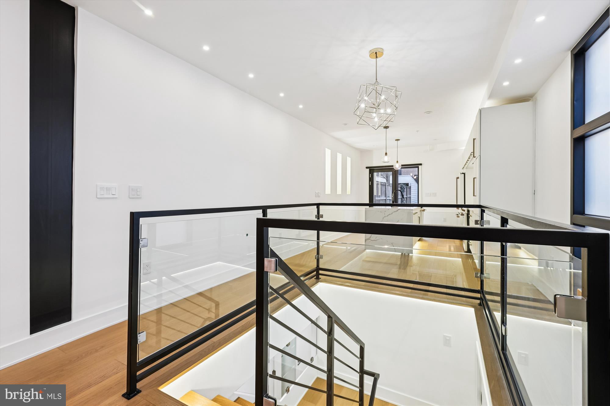 746 Morton Street Northwest, Unit 1 Washington, DC 20010 - Photo 14 of 35 a view of staircase with furniture and a window