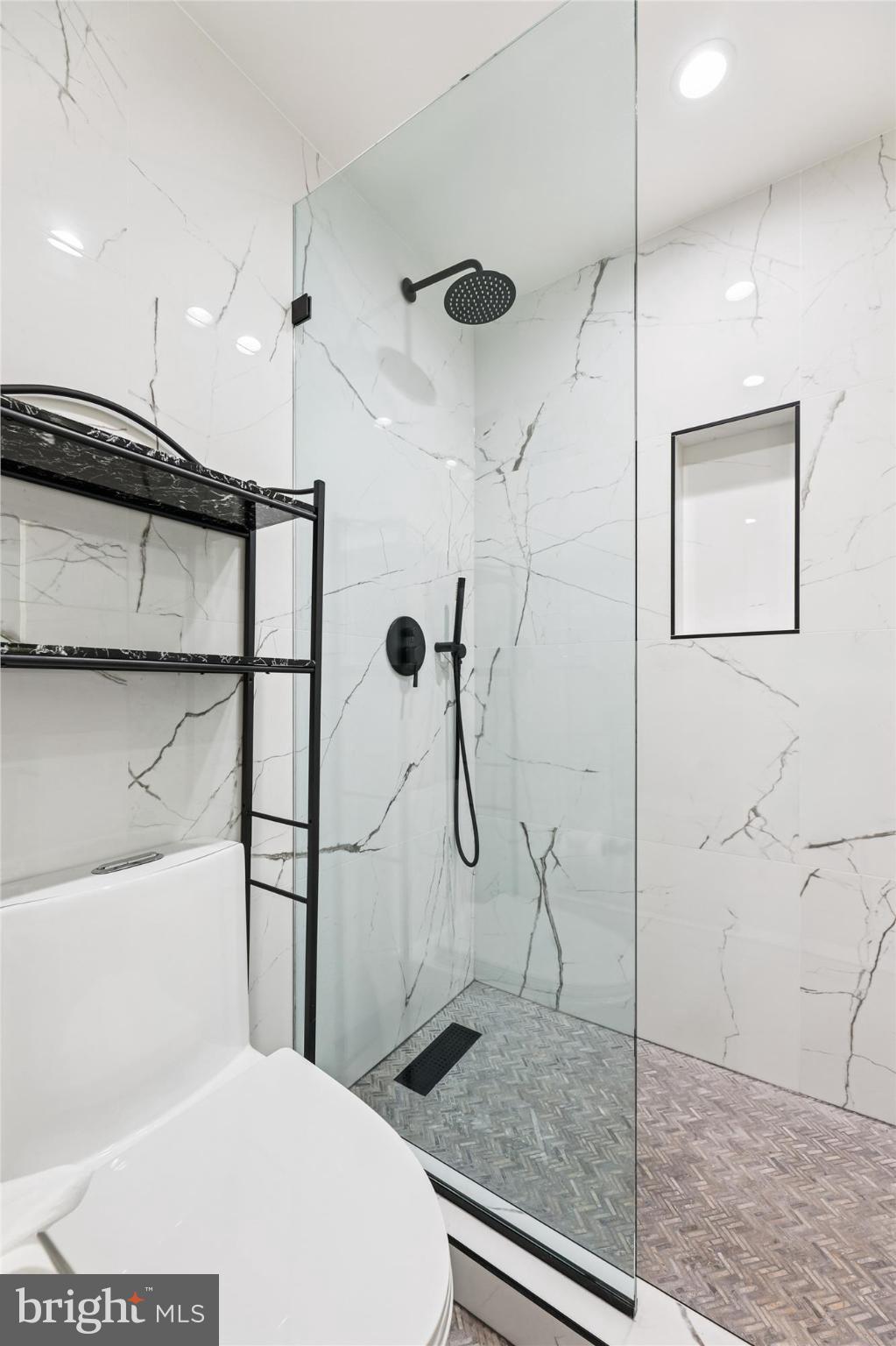 746 Morton Street Northwest, Unit 1 Washington, DC 20010 - Photo 18 of 35 a bathroom with a shower a toilet and sink