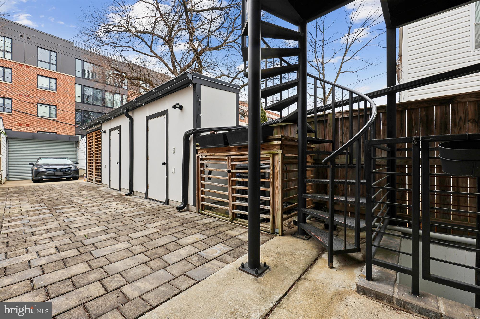 746 Morton Street Northwest, Unit 1 Washington, DC 20010 - Photo 9 of 35 a backyard of a house with barbeque oven and outdoor seating