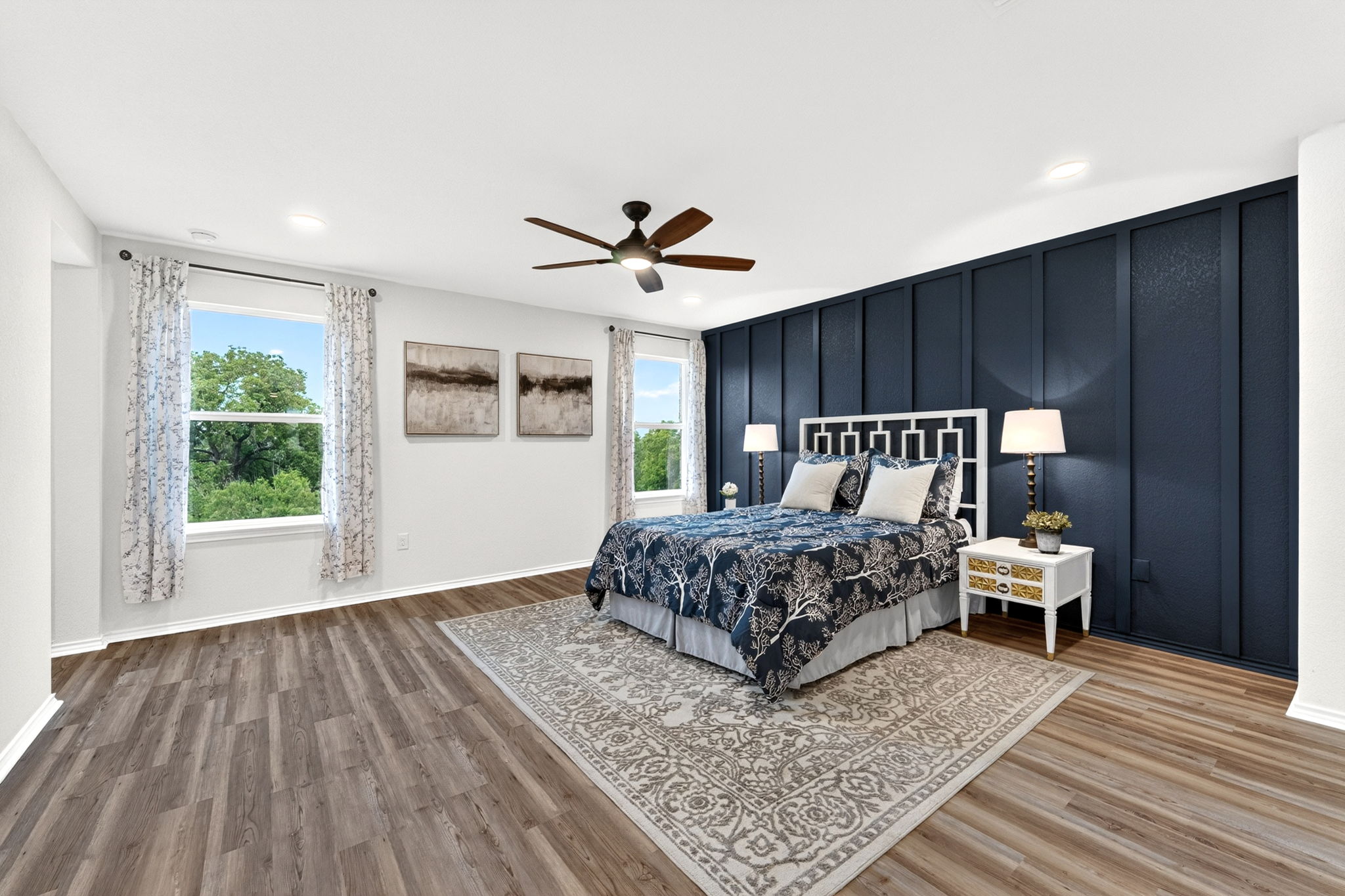 326 Linden Street Bastrop, TX 78602 - Photo 5 of 39 Oversized primary bedroom that overlooks the greenspace out back. Easy maintenance with LVP floors throughout.
