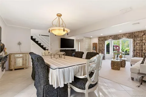 a very nice looking dining room with a table and chairs