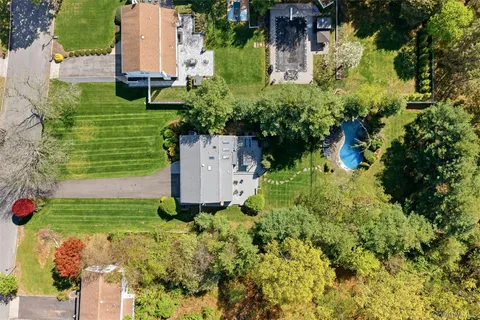an aerial view of a house with a garden