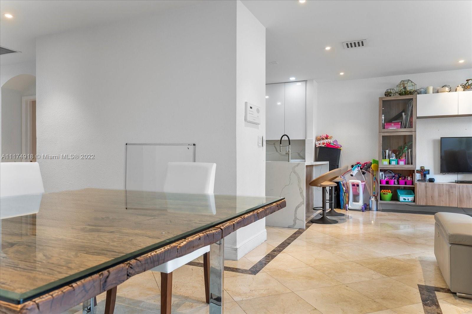 Doral Isles Doral, FL 33178 - Photo 13 of 38 a view of a kitchen with kitchen island and a sink