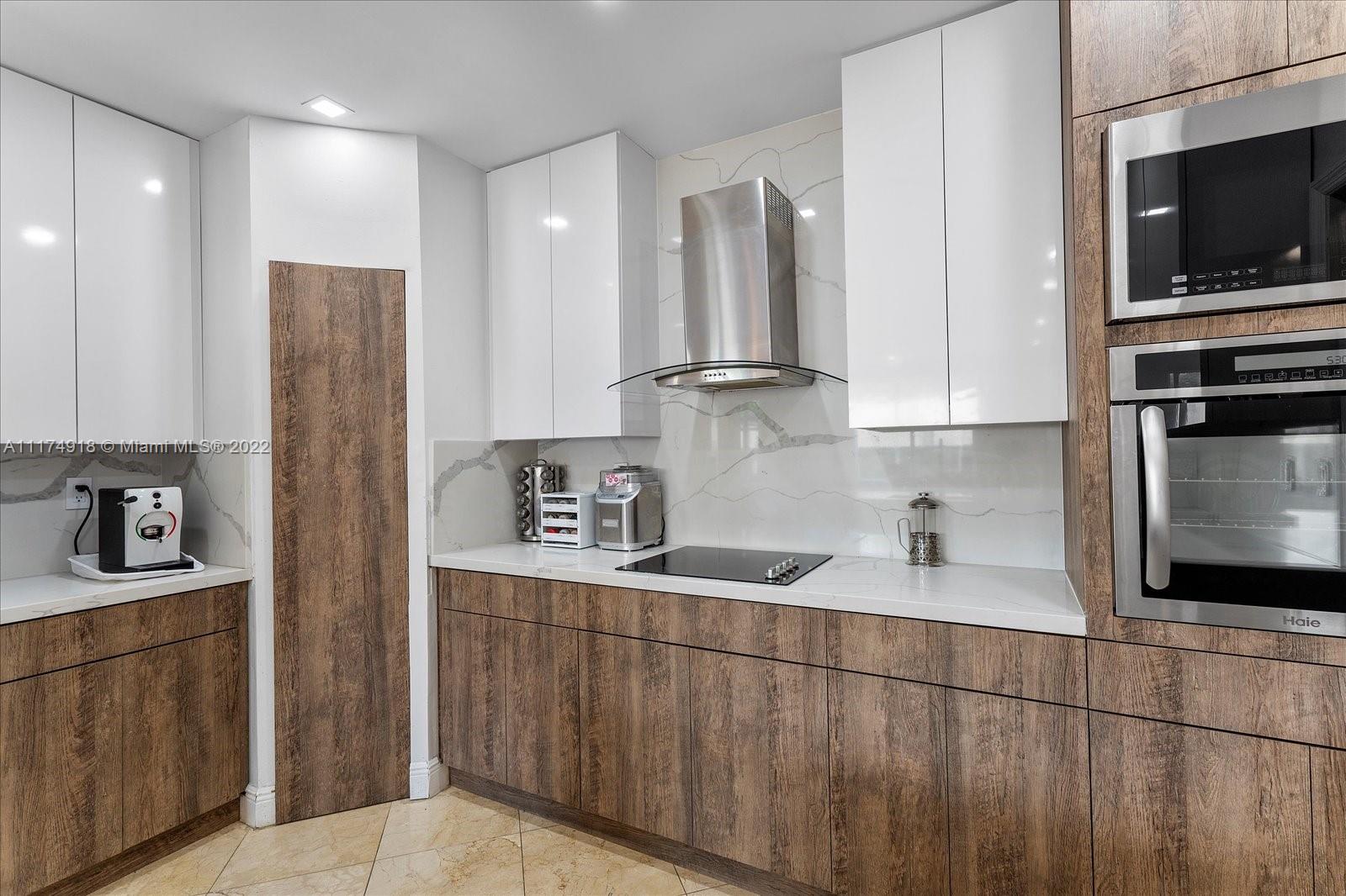 Doral Isles Doral, FL 33178 - Photo 18 of 38 a kitchen with stainless steel appliances granite countertop a refrigerator and a sink