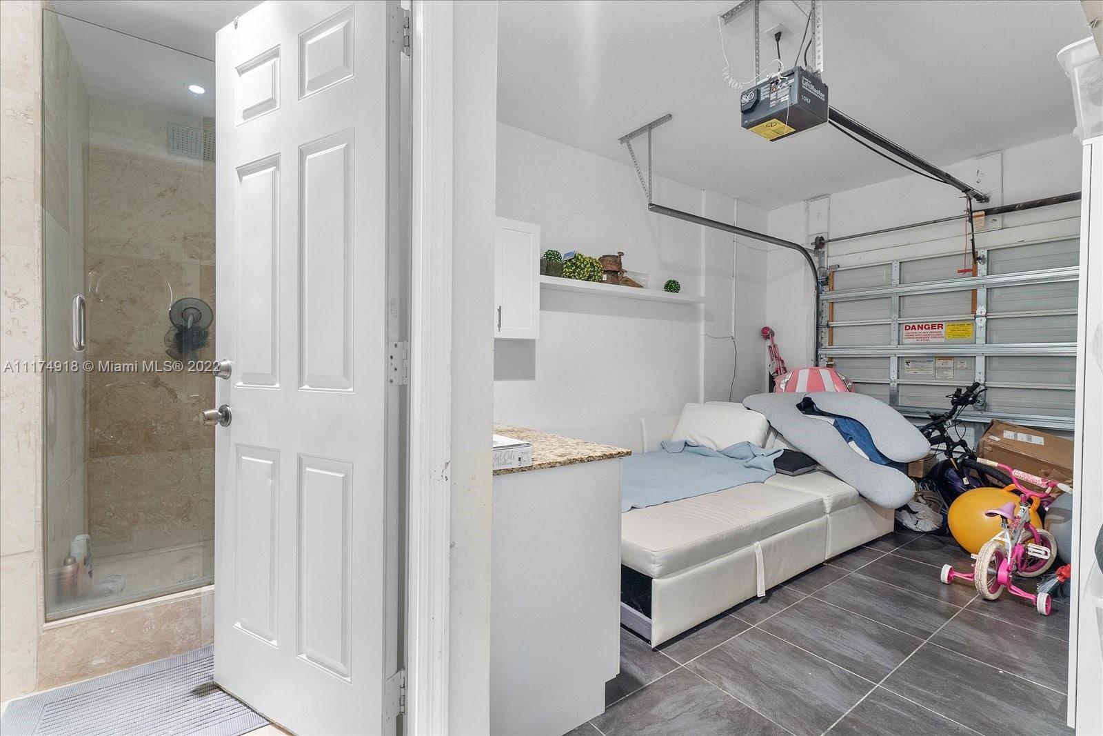 Doral Isles Doral, FL 33178 - Photo 20 of 38 a bedroom with furniture and a window